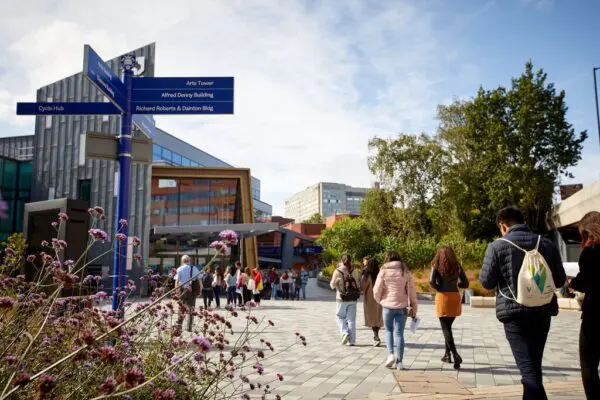 Students walking towards the main entrance of the University of Sheffield Students Union building